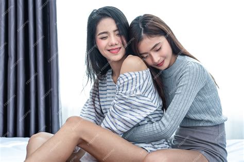 Premium Photo Two Asian Lesbian Women Hug And Embracing Together In Bedroom