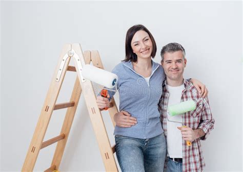 Happy Couple Renovating Their Home Stock Image Image Of Posing Friends 91374331