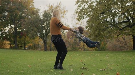 Mom And Son Are Walking In The Autumn Park Stock Footage Video Of