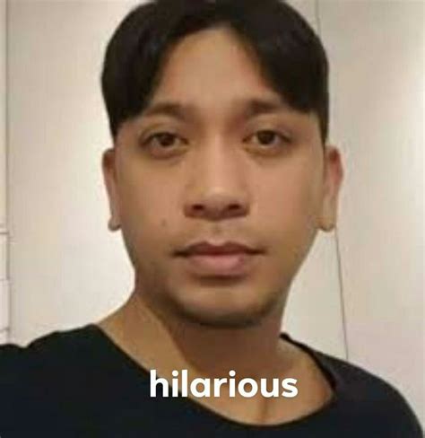 A Man In Black Shirt Looking At The Camera