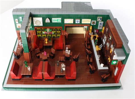 a lego model of a restaurant with tables and chairs