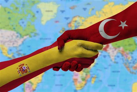 Handshake Between Spain And Turkey Flags Painted On Hands Stock Image