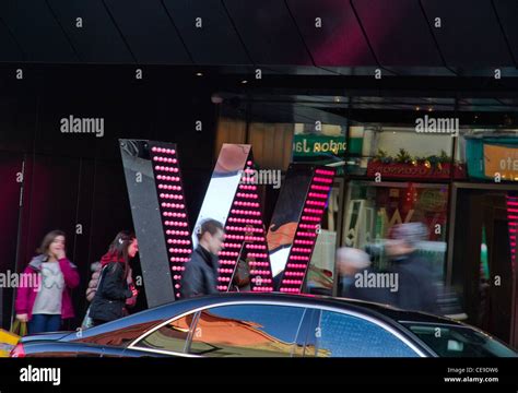 London England neon sign outside building West End Stock Photo - Alamy