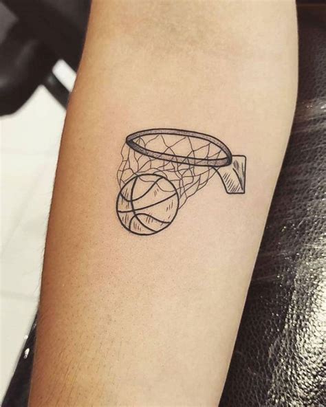 A Tattoo On The Arm Of A Person With A Basketball Hoop In Front Of It