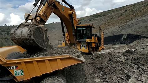 CAT HD 777E LOADING OB EXCAVATOR CAT 6020B YouTube