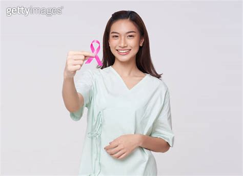 Happy Smile Asian Woman Patient Showing Pink Badge Ribbon Chest To