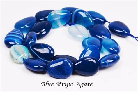 Blue Striped Agate Beads Are Arranged In A Circle On A White Background