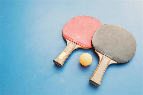 Table tennis equipment on blue table 9299538 Stock Photo at Vecteezy