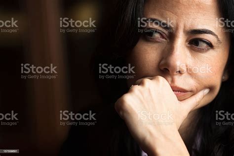 Portrait Of A Pensive Woman With A Furrowed Brow Stock Photo Download