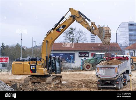 Yellow Crawler Excavator Cat F Ln Loading A Truck On Construction