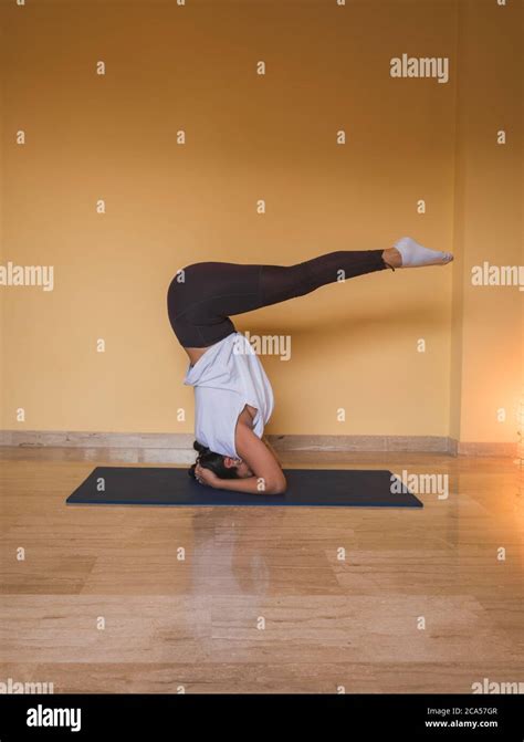 Anonymous Woman Starting Supported Headstand Pose Side View Of Slim