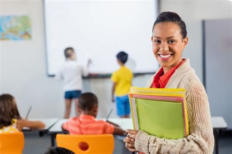 Premium Photo | A teacher smiling at camera