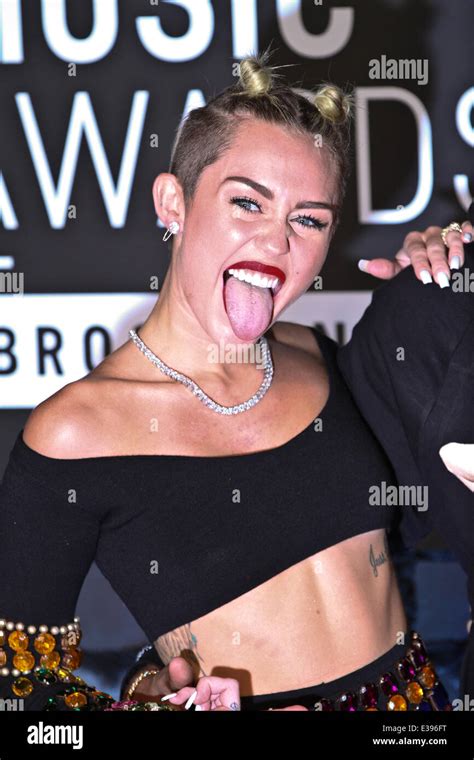 Miley cyrus tongue hi-res stock photography and images - Alamy