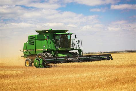 Combine John Deere Combine Harvesting Wheat In Colorado Photograph By