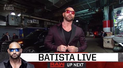 Two Men In Suits And Sunglasses Standing Next To Each Other With The Caption Batista Live