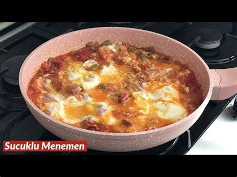 A Pan Filled With Food Sitting On Top Of A Stovetop Next To An Oven