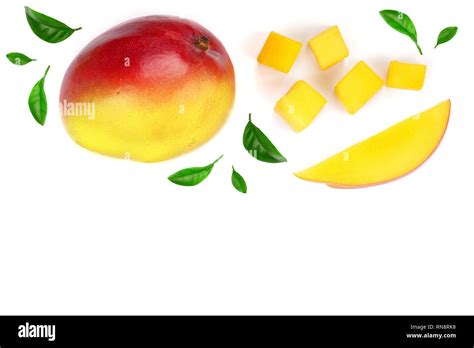 Mango Fruit And Slices Decorated With Leaves Isolated On White