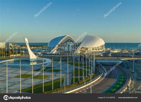 Sochi, Russia - October 2019: Olympic flame and square with flags in ...