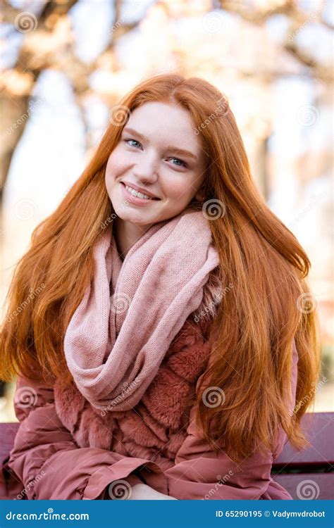 Smiling Redhead Woman Sitting On The Bench Outdoors Stock Image Image