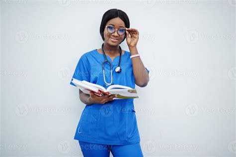 Portrait of happy female african american young doctor pediatrician in ...