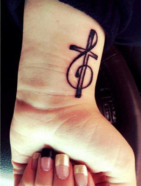 Details 143+ cross and music note tattoo latest - vova.edu.vn