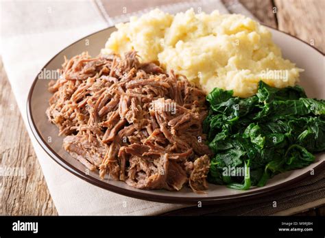 Botswana cuisine: seswaa beef stew with pap porridge and spinach close ...