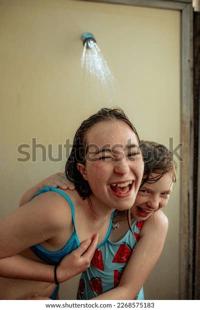 Happy Sisters Laughing Outdoor Shower After Stock Photo