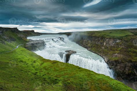 Gullfoss Powerful Waterfall Flowing From Hvita River And Moody Sky In