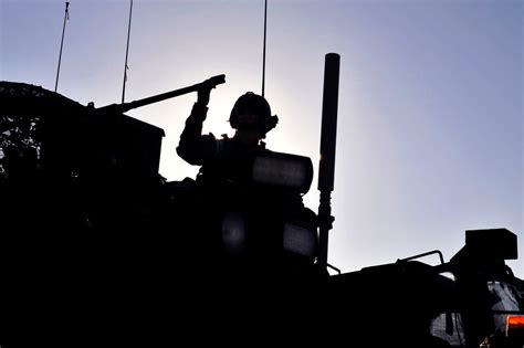 A Us Soldier Prepares To Bore Sight A Remote Weapon System On A