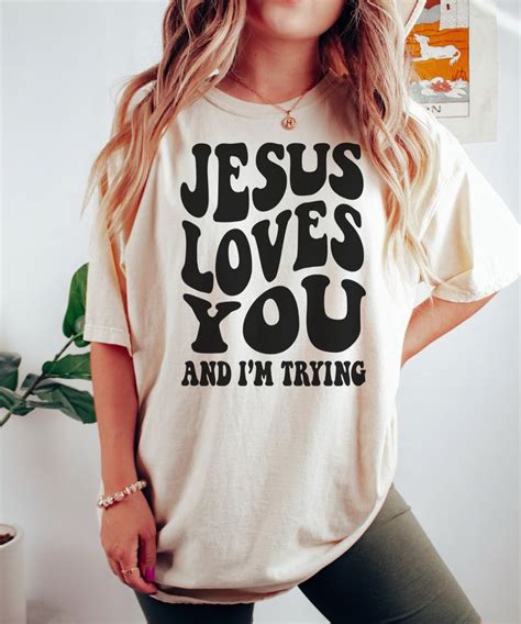 Jesus Loves You And I M Trying Unisex T Shirt Please Size Up 2 Sizes