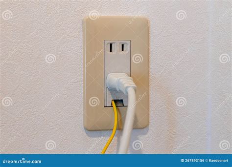 Power Plug And Earth Wire Connected To Japanese Electrical Outlet