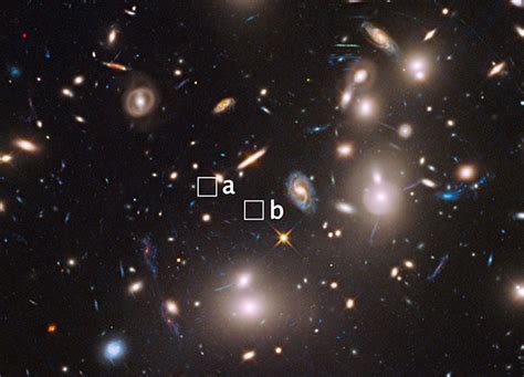 Hubble Finds Extremely Distant Galaxy Through Cosmic Magnifying Glass