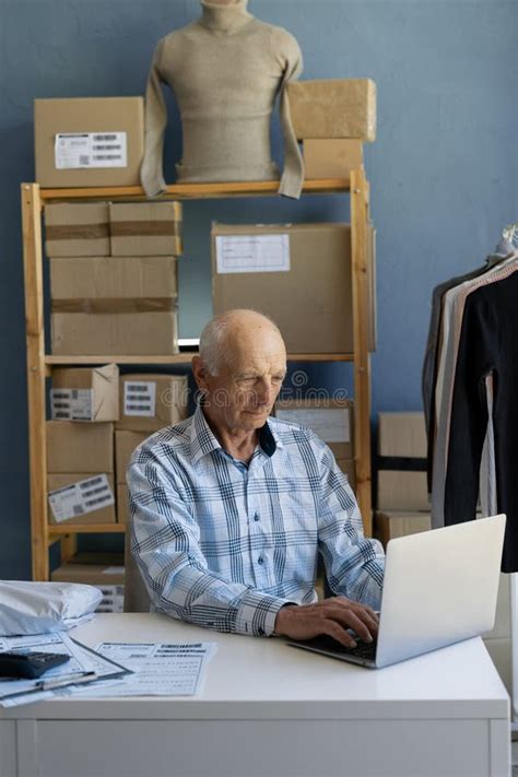 Busy Smart Mature Owner Man Sitting Working On Laptop Elderly