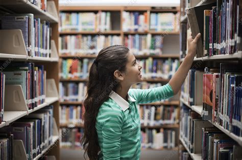 A Girl Looking At Books In A Library Stock Image F0133805