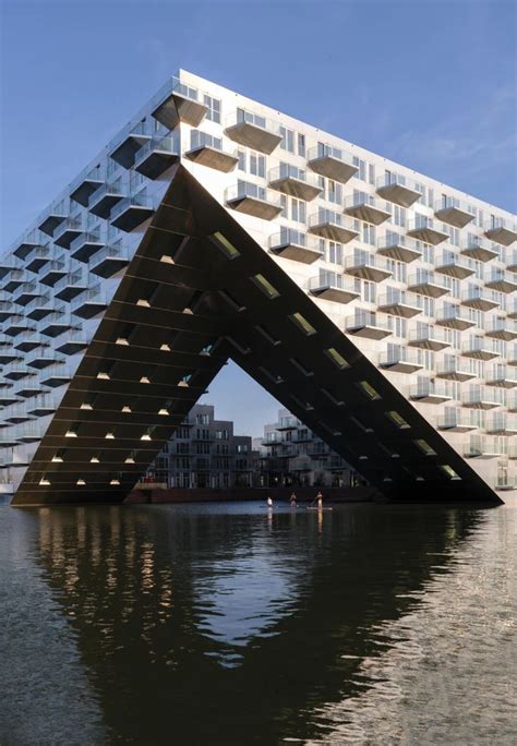 The Building Is Shaped Like An Upside Down Triangular Structure With