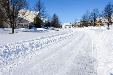 Snow Covered Street After Recent Plowing Stock Photo Download Image