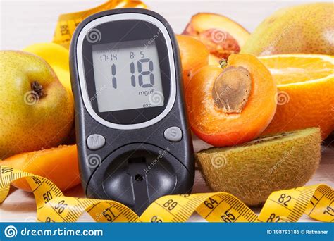 Glucometer Tape Measure And Fresh Natural Fruits Containing Vitamins