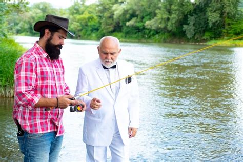 Premium Photo Two Men Friends Fishing Flyfishing Angler Makes Cast