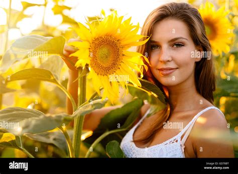 Beautiful Happy Woman Surrounded By Sunflowers Stock Photo Alamy