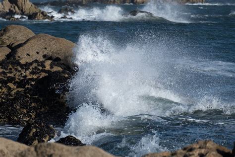 Powerful Ocean Waves Crashing Against Rocks On The Shore Stock Image