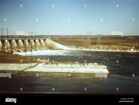 Landscape Photograph Of Spillways At A Hydroelectric Dam With Overhead