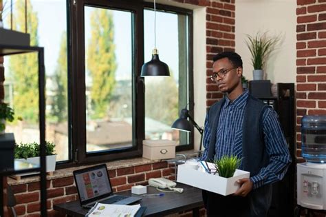 Premium Photo Start Up Employee Getting Fired Looking Sad Holding