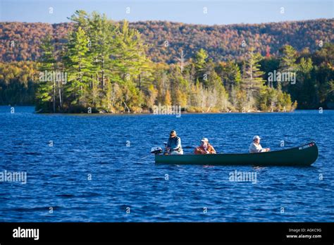 Fishing From A Canoe On Prong Pond Near Moosehead Lake In Maine Stock