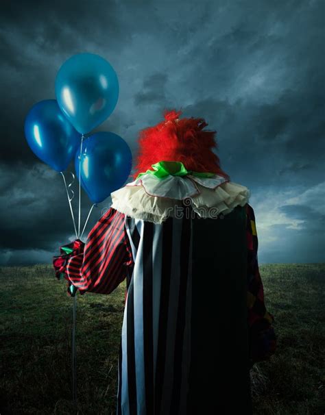 Scary Clown on a Field at Night Stock Image - Image of clown, mask ...