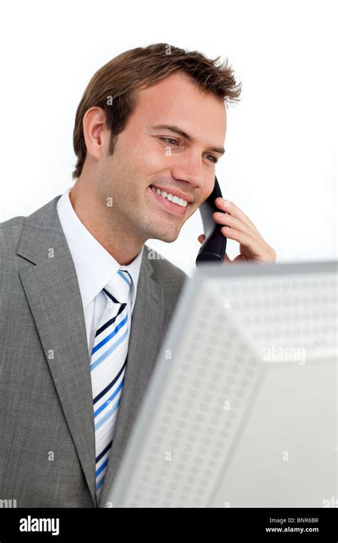 Charming Businessman On Phone At A Computer Stock Photo Alamy