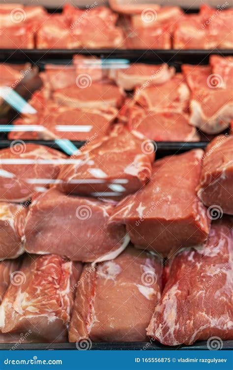 Pieces Of Fresh Chilled Beef On The Counter Under The Glass Selection