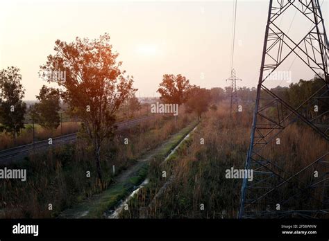 Train track during sunset time Stock Photo - Alamy