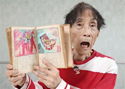 An Old Man Holding Up A Book In Front Of His Face With The Pages Open