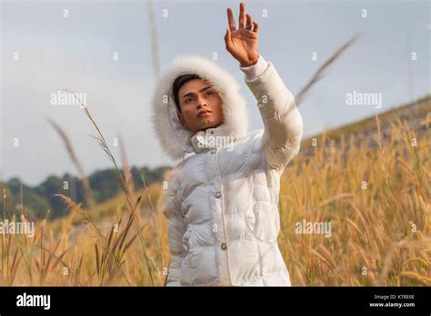 A Gay Wear Winter Clothes Walking In A Flowering Meadow In Winter The Weather Getting Cool