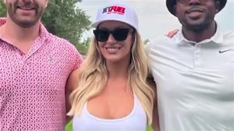 Paige Spiranac Puts On Busty Display In Short White Dress As She Works Up A Storm On The Golf